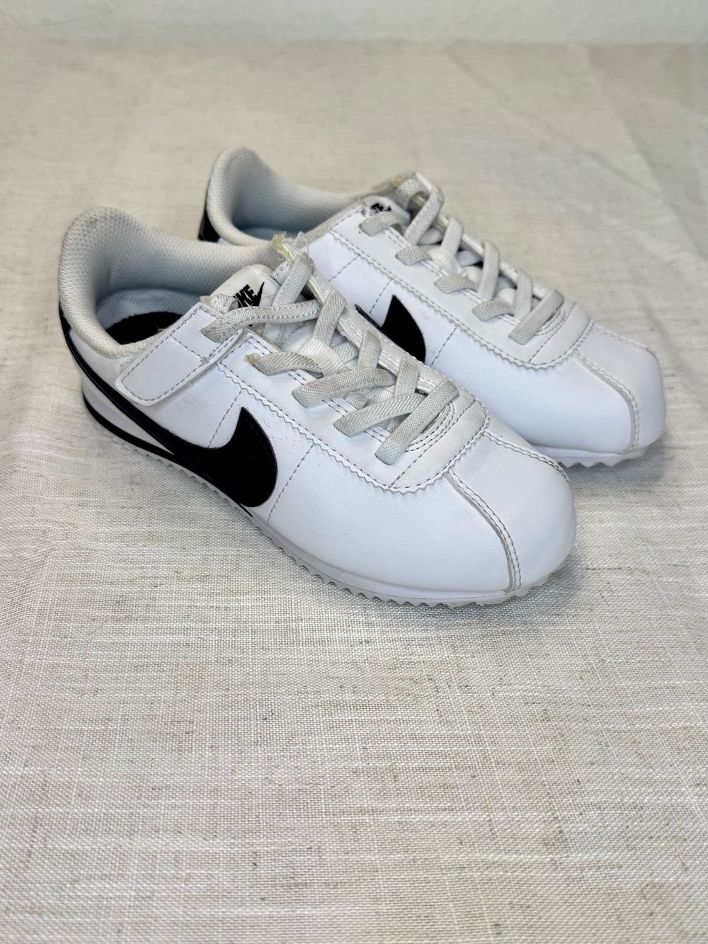 Nike Kids White Sneakers with Black Swoosh